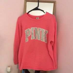 Pink sweatshirt/top with silver glitter details.